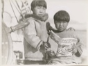Image of Boys looking at Etuk- The Eskimo [Inuk] Hunter by Miriam MacMillan